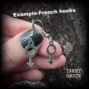 This pair of earrings features antique silver Male/Mars symbols, are nice and lightweight (at a gram or two each), measuring approx 3.5cms from tip to tip.

This pair has been made on stainless steel french hooks, for pierced ears.