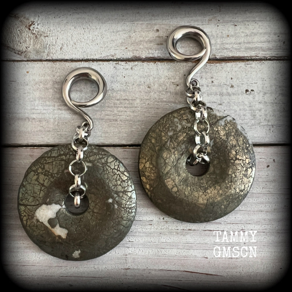 These beautiful big gauged earrings feature gorgeous Pyrite donut gemstones cradles in chunky antique silver chain, measuring just over 9cms from tip to tip, and weighing approx 55 grams each.

This pair has been made on 2 gauge (6mm) surgical steel full curls, to be worn in stretched lobes.