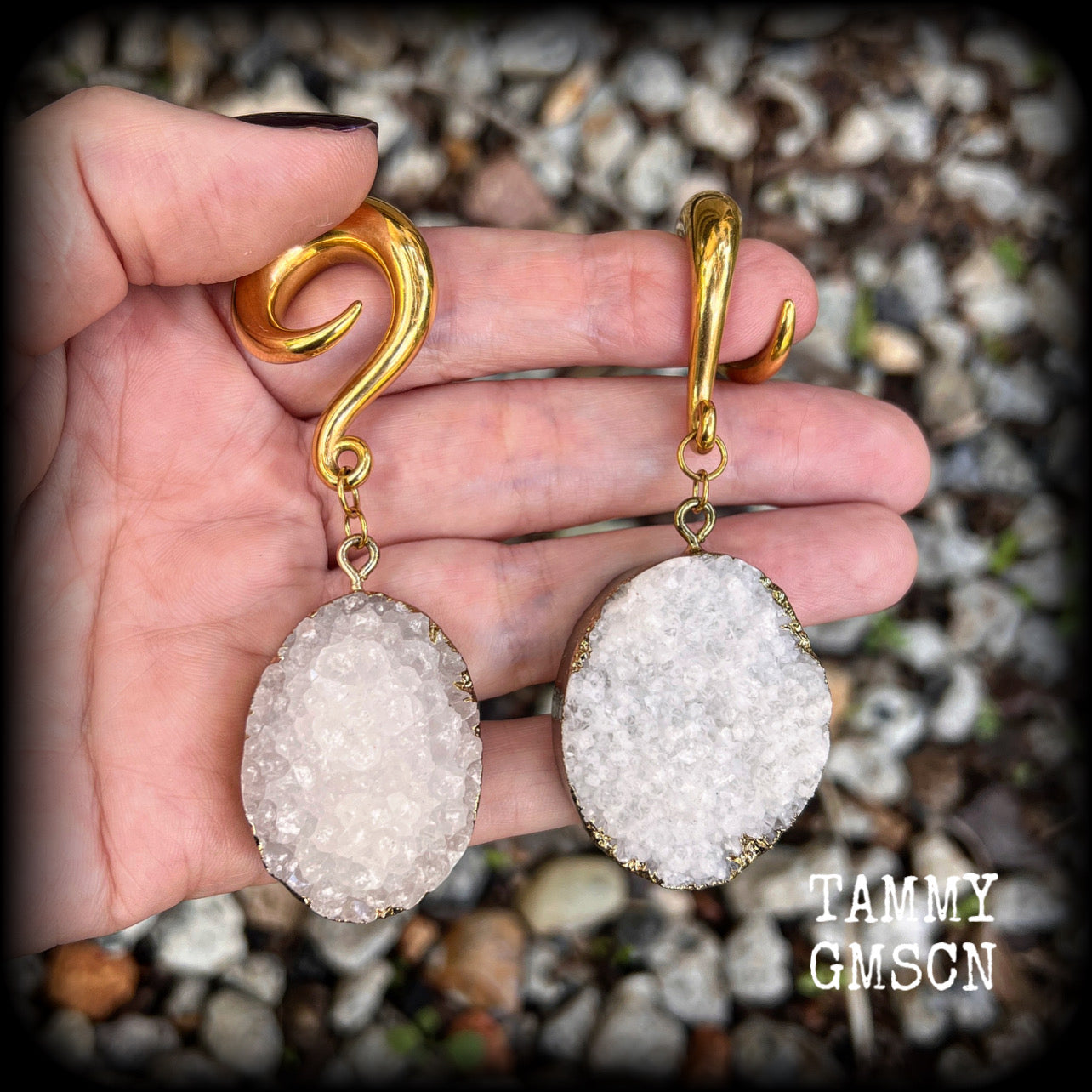 These big beautiful gauged earrings feature snow white and antique gold druzy pieces, measuring just on 8cms from tip to tip, and weighing approx 35 grams a piece.

This pair have been made on 0 gauge (8mm) surgical steel full curl hooks, suitable for stretched lobes.