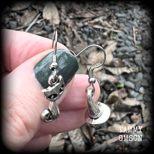 These adorably witchy earrings feature a cute antique silver black cat and witches hat! These earrings are nice and light weight at only a gram or two each, measuring just under 4cms from tip to tip.

This pair has been made on stainless steel french hooks, suitable for pierced ears.