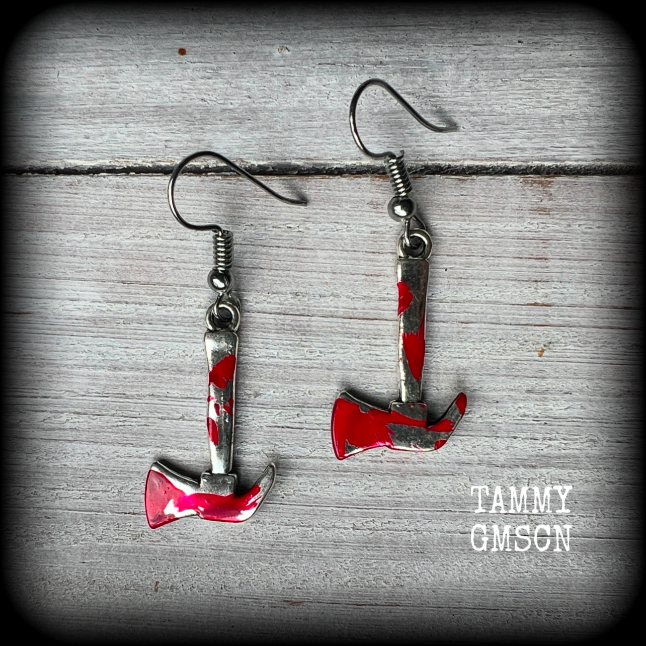 These awesome little 'Lizzie Borden' earrings 
feature an antique silver pickaxe and adorned with b l o o d spatter, measuring approx 5 cms from tip to tip and weighing only a gram or two each.

This pair has been made with stainless steel french hooks, for pierced ears.