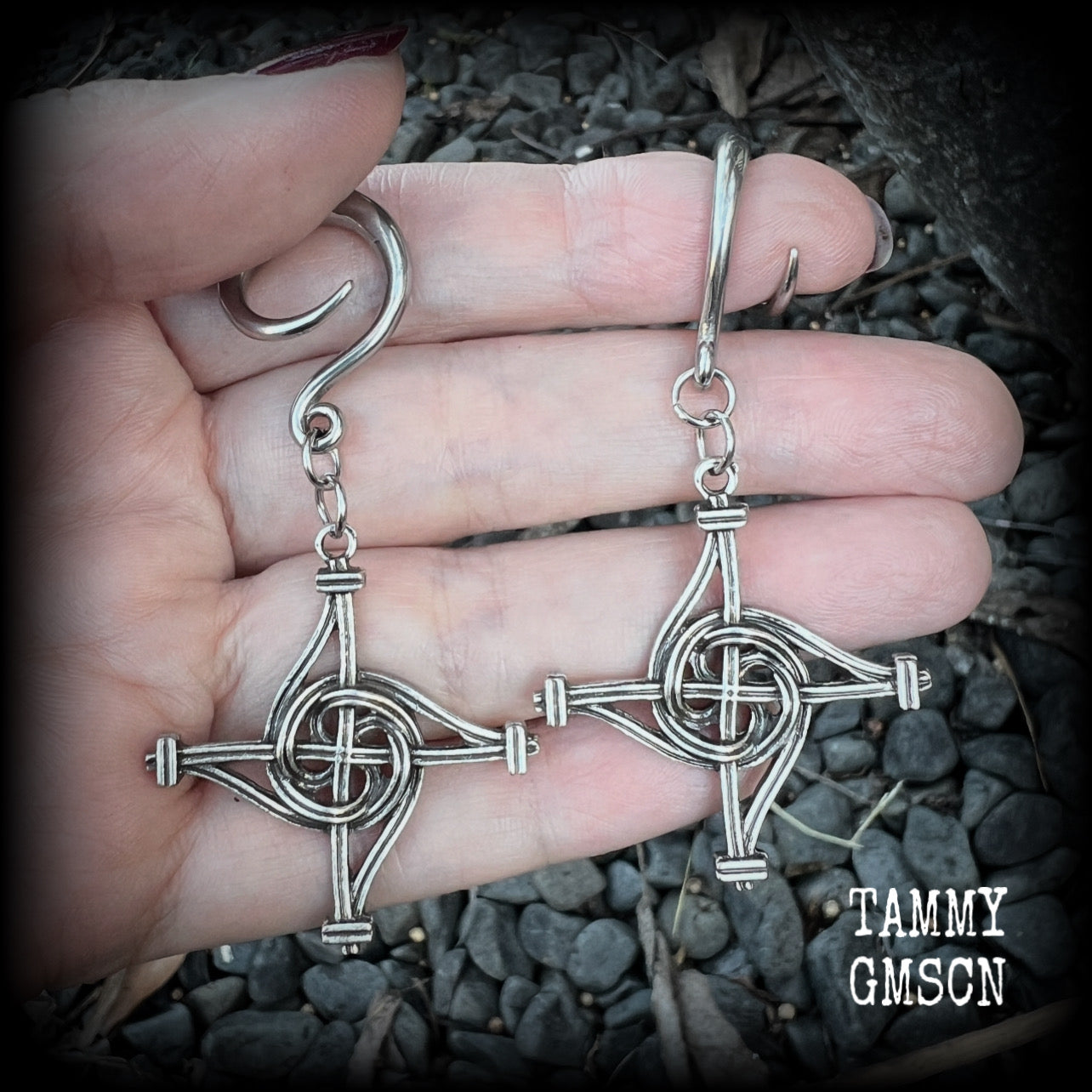These gorgeous gauged earrings feature antique silver interwoven Brigids crosses, measuring approx 7.5cms from tip to tip, and weighing approx 7 grams each.

This pair has been made on 6 gauge (4mm) surgical steel full curl hooks, suitable for stretched lobes.