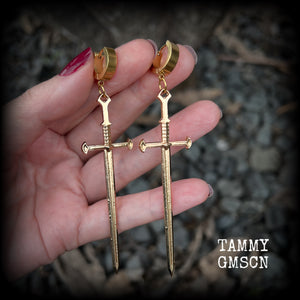 These awesome dangly antique gold sword earrings are nice and lightweight at 7 grams each, and measure in at just under 9cms from tip to tip.
This pair have been made on stainless steel huggie ear cuffs, suitable for pierced ears.