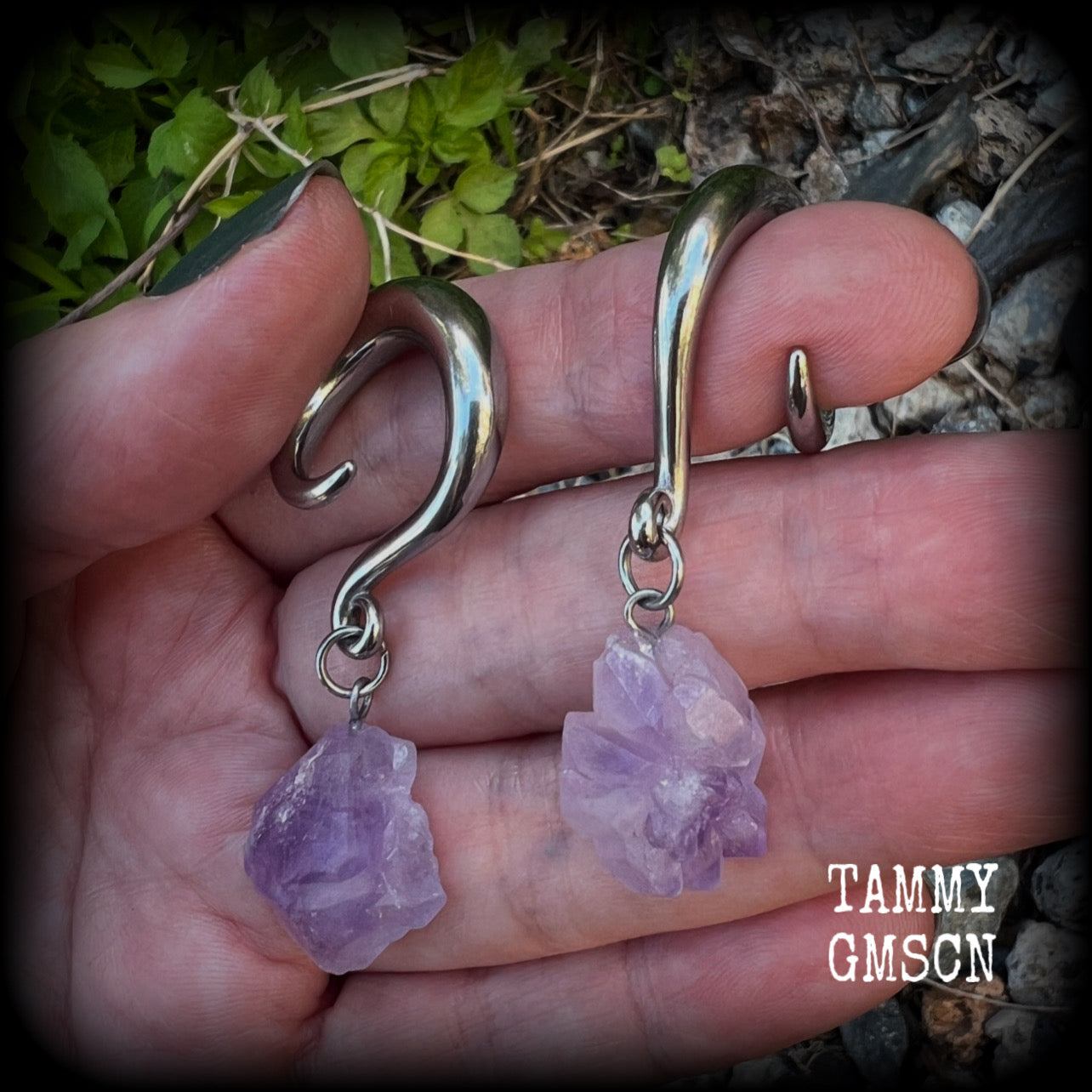 These gorgeous gauged earrings feature beautiful purple raw amethyst gemstones, measuring just under 6cms from tip to tip, and weighing approx 10 grams each, not too heavy...

This pair have been made on 2 gauge (6mm) surgical steel full curl hooks, to be worn in stretched lobes.