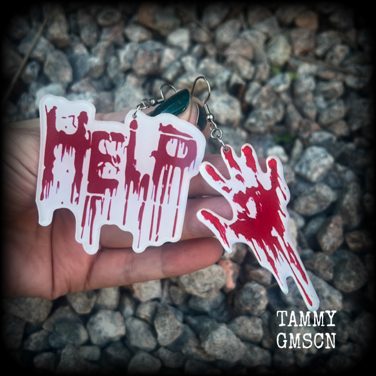 These awesome horror movie inspired earrings feature a bloodied hand print alongside ‘HELP’ finger painted in blood, measuring approx 7.5cms from tip to tip, and weigh only a few grams each.

This pair has been made with stainless steel french hooks, suitable for pierced ears.