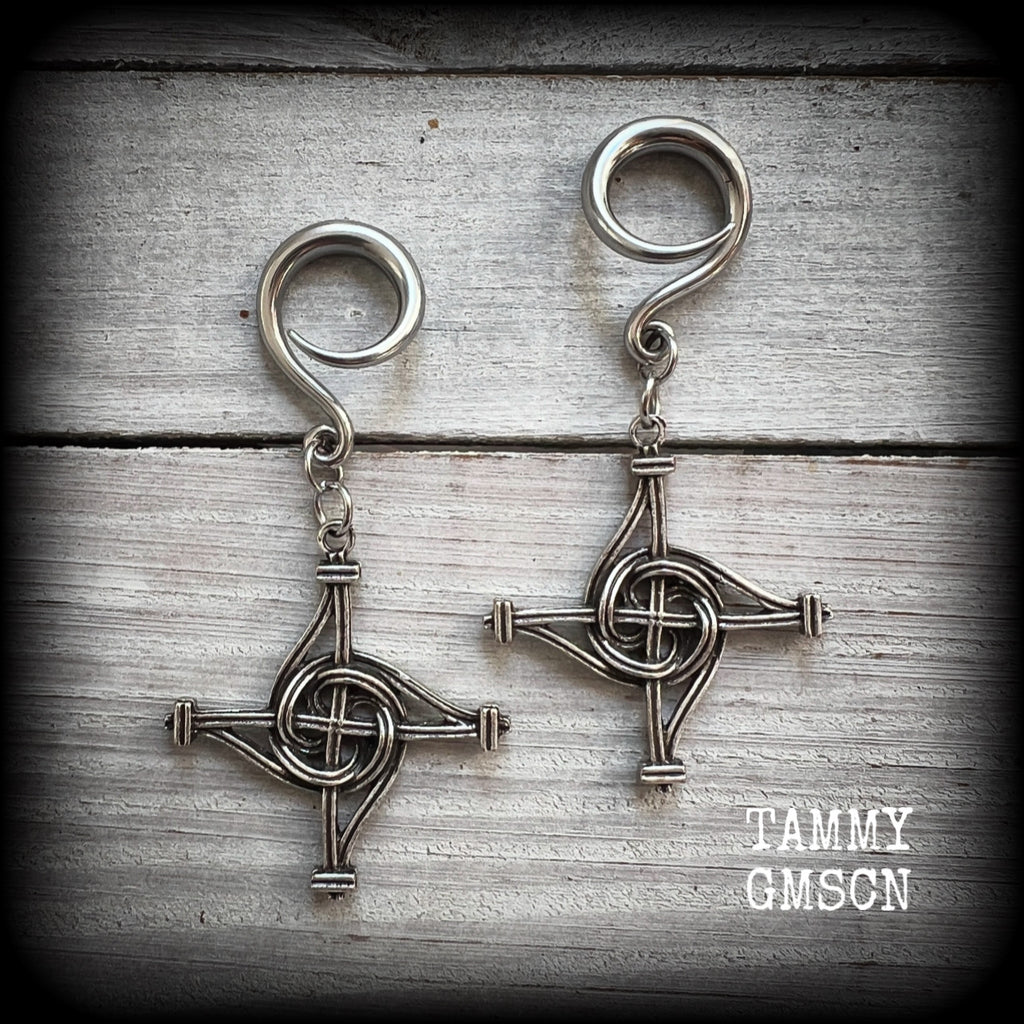 These gorgeous gauged earrings feature antique silver interwoven Brigids crosses, measuring approx 7.5cms from tip to tip, and weighing approx 7 grams each.

This pair has been made on 6 gauge (4mm) surgical steel full curl hooks, suitable for stretched lobes.