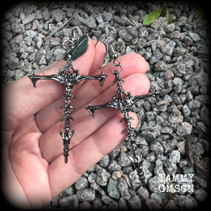 These gorgeous gothic earrings feature gunmetal grey skeleton crosses, measuring just over 8 cms from tip to tip, and weigh approx 7 grams a piece.

This pair have been made on stainless steel french hooks, suitable for pierced ears.