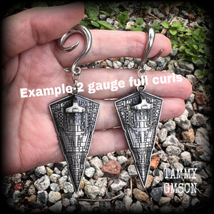 These awesome Star Wars Imperial Star Destroyer gauged earrings are nice and big, measuring just under 10cms from tip to tip, and not too heavy at 28 grams a piece.


This pair has been made on 2 gauge (6mm) surgical steel full curl hooks, to be worn in stretched lobes.