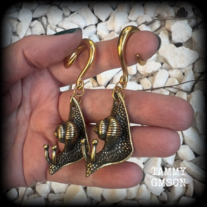 These awesome brass snail ear hangers feature gorgeous brass garden snails, measuring just on 7.5cms from tip to tip, and weighing approx 30 grams each.

This pair has been made on 2 gauge (6mm) surgical steel full curls, suitable for stretched lobes.