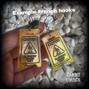 These awesome fluoro yellow acrylic ‘Slippery when wet’ sign earrings measure in at just on 7cms, are nice and light weighing only 4 grams each.

This pair has been made with stainless steel french hooks, for pierced ears.