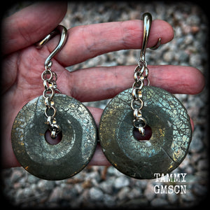 These beautiful big gauged earrings feature gorgeous Pyrite donut gemstones cradles in chunky antique silver chain, measuring just over 9cms from tip to tip, and weighing approx 55 grams each.

This pair has been made on 2 gauge (6mm) surgical steel full curls, to be worn in stretched lobes.