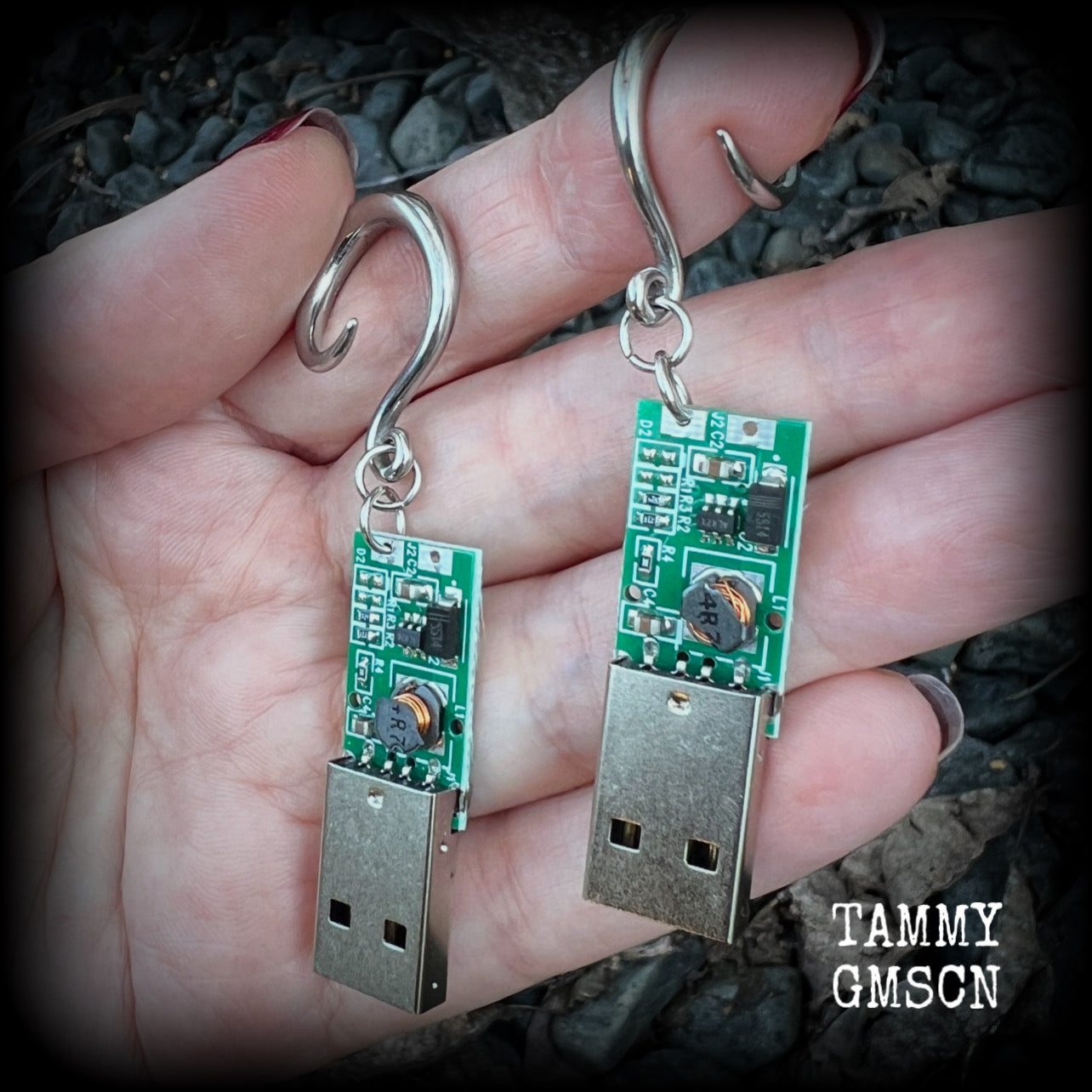 These awesome earrings feature a classic green USB, are nice and dangly, measuring approx 7cms from tip to tip, and nice and light weight, weighing only 6 grams each.

This pair has been made on 6 gauge (4mm) surgical steel full curl hooks, to be worn in stretched lobes.