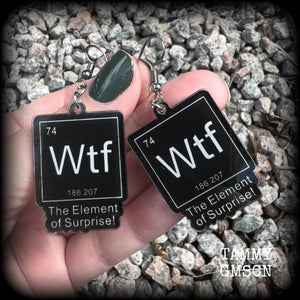 This cheeky pair of earrings features acrylic letter tiles showing the chemical element of Wtf, the Element of Surprise!!!
Measuring just over 6cms from tip to tip, these earrings weigh only a few grams each.

This pair has been made with stainless steel french hooks, suitable for pierced ears.