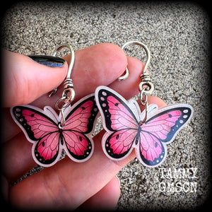 This is a pair of beautiful pink butterfly earrings, available on a selection of hooks and clasps for pierced ears and stretched lobes.