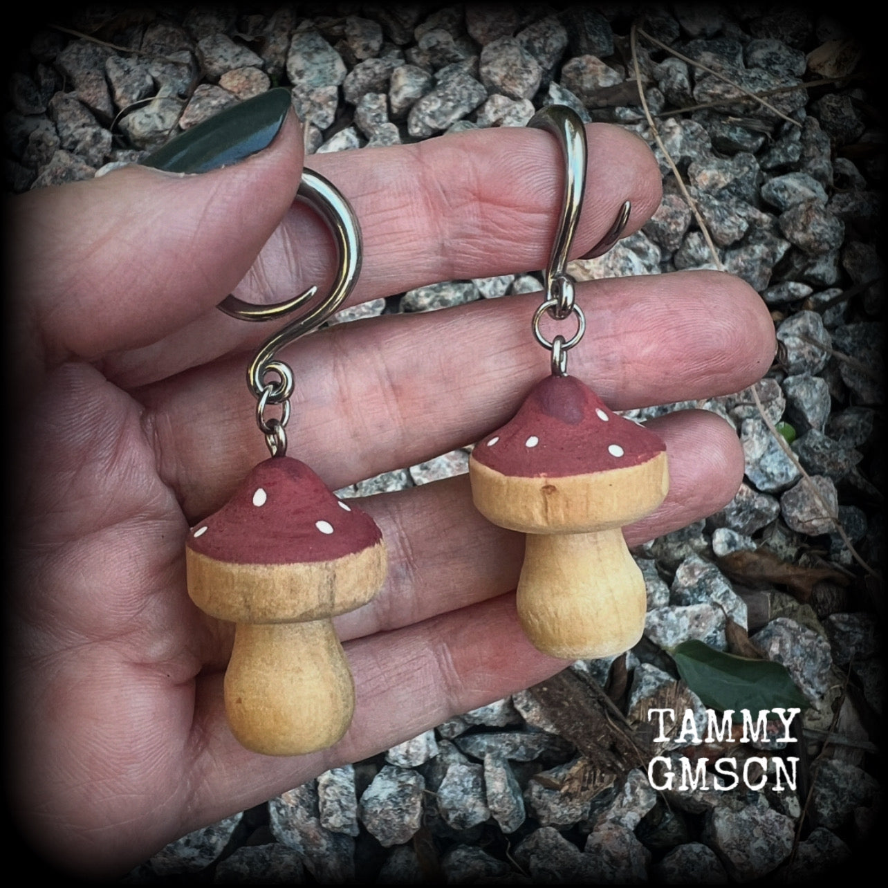 This pair of earrings features gorgeous dusty pink wood mushrooms, nice and light weight at 7 grams a piece, and nice and dangly at just on 6.5cms from tip to tip.

This pair has been made on 6 gauge (4mm) surgical steel full curl hooks, suitable for stretched lobes.