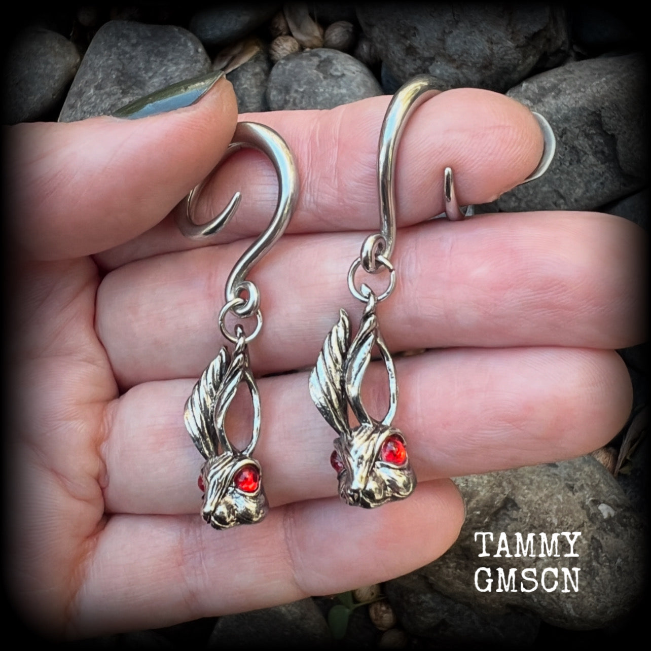 Featuring super cute, slightly creepy antique silver zombie rabbits complete with red eyes, these earrings weigh 7 grams each, and are lovely and dangly at approx 5.5cms from tip to tip.

This pair has been made on 6 gauge (4mm) surgical steel full curl hooks, to be worn in stretched lobes.