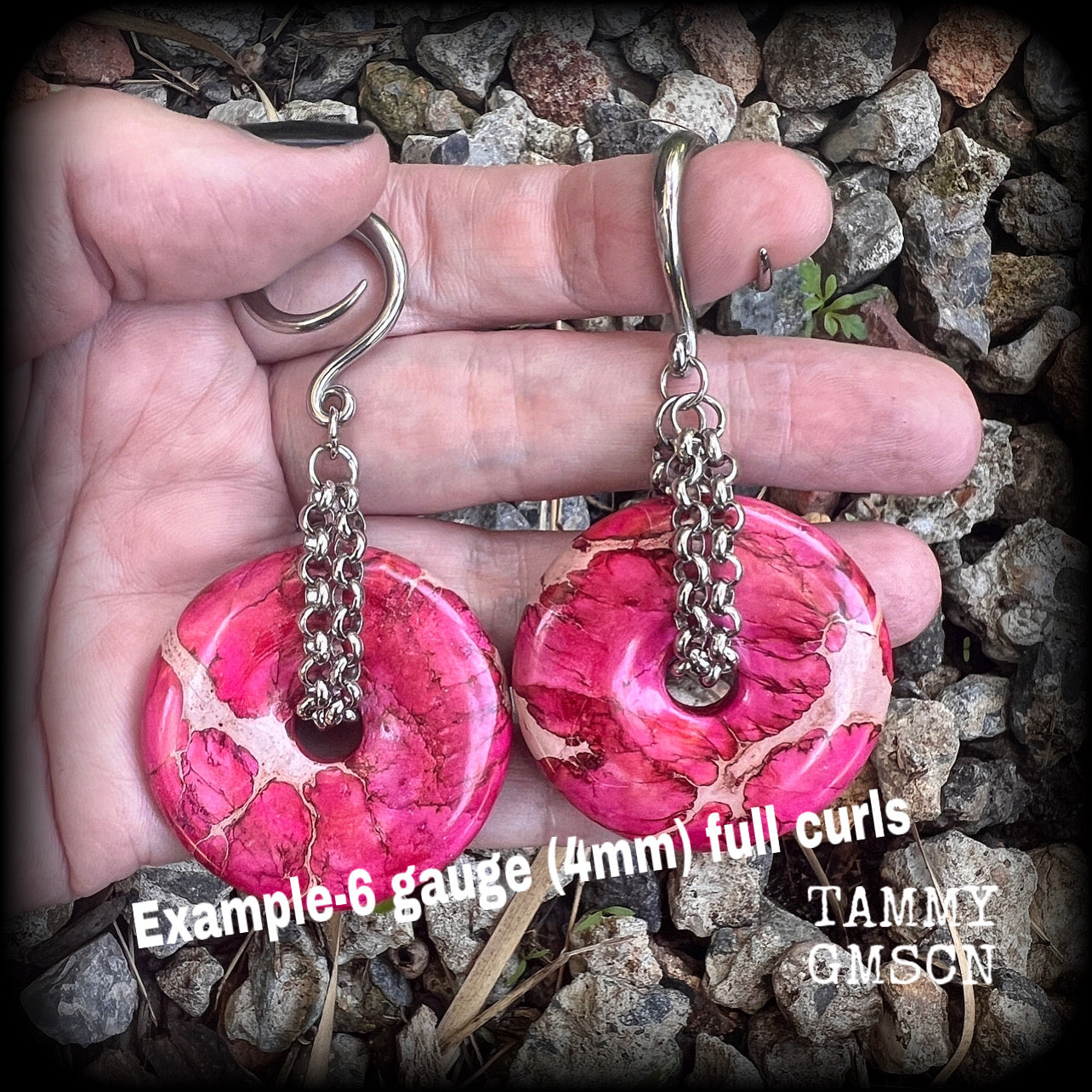 This pair of gorgeous ocean jasper earrings features beautiful pink marbled donut gemstones, weighing approx 19 grams a piece, and measuring 8cms from tip to tip.

This pair has been made on 6 gauge (4mm) surgical steel full curl hooks, to be worn in stretched lobes.