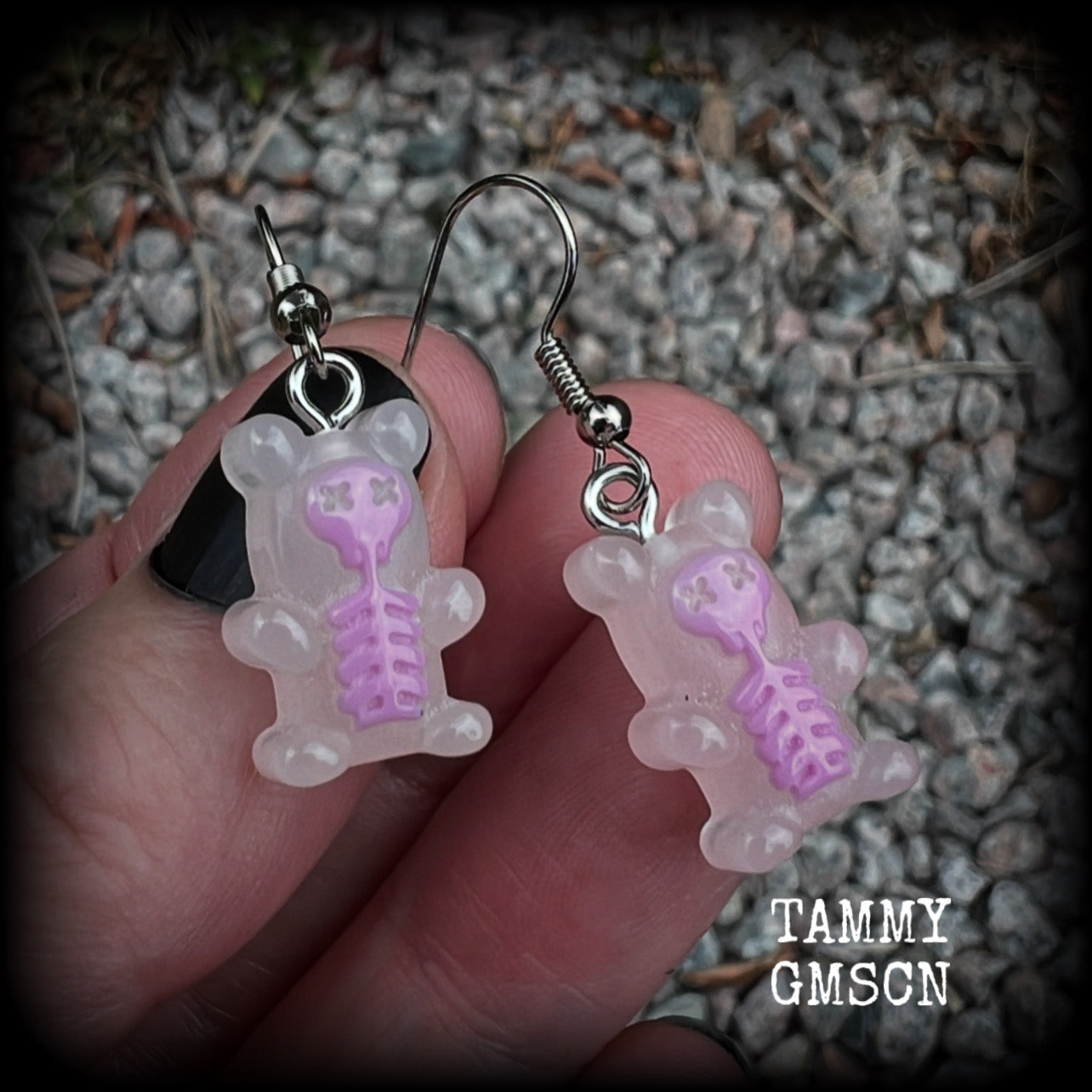 Featuring spooky cute pink skeleton gummy bears, these adorable earrings measure just on 5cms from tip to tip and are super light weight, weighing only a gram or two each.

This pair has been made with stainless steel french hooks, to be worn in pierced ears.