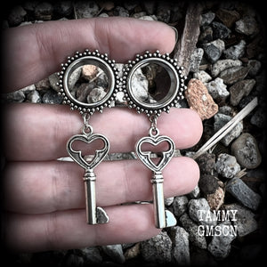 These gothic cathedral inspired tunnel earrings feature gorgeous antique silver keys, weighing approx 9 grams each, and measuring just under 6cms from tip to tip.

This pair have been made on 5/8” gauge (16mm) ornate surgical steel tunnels, suitable for stretched lobes.