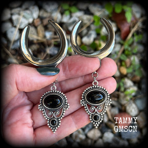 These beautiful ear hangers have been made with gorgeous pitch black obsidian gemstones in an antique silver boho setting, lovely and dangly at 8.5cm from tip to tip, and weighing approx 15 grams each.

These earrings have been made on 1.18” gauge (30mm) surgical steel cradles, to be worn in stretched lobes.
