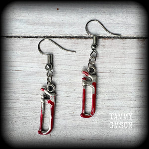 These awesome horror movie inspired earrings feature antique silver bone saws and adorned with b l o o d spatter, measuring approx 4cms from top to tip and weighing only a gram or two each.

This pair has been made with stainless steel french hooks, for pierced ears.