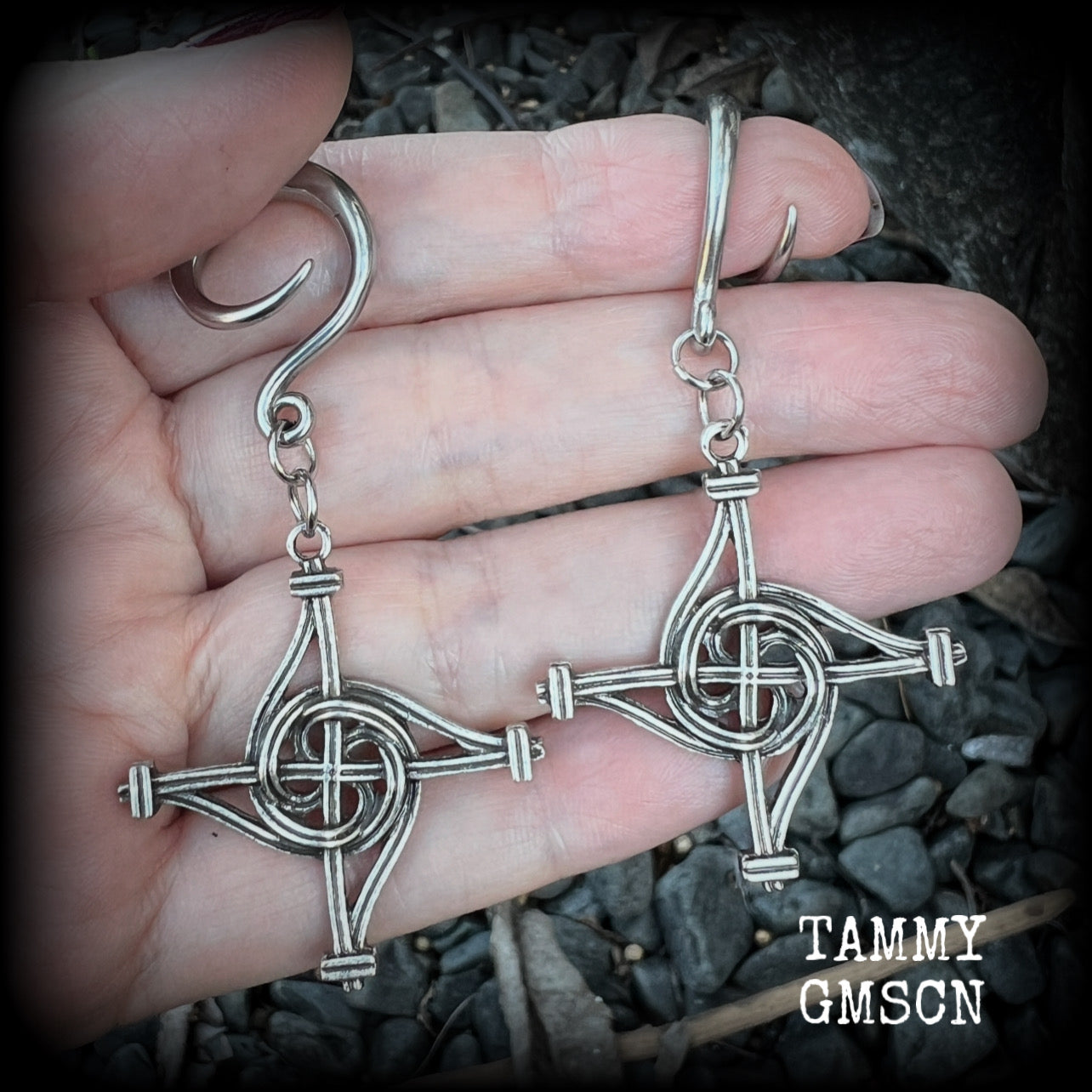 These gorgeous gauged earrings feature antique silver interwoven Brigids crosses, measuring approx 7.5cms from tip to tip, and weighing approx 7 grams each.

This pair has been made on 6 gauge (4mm) surgical steel full curl hooks, suitable for stretched lobes.