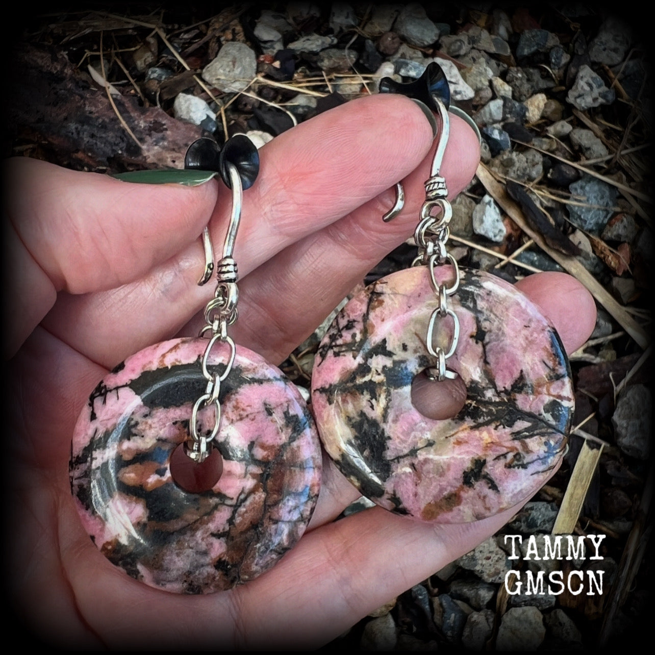 This is a pair of gorgeous ear hangers featuring dusty pink and chocolate brown Rhodonite gemstone donuts cradled in antique silver chain, weighing approx 23grams a piece, and measuring just under 7 cms from tip to tip.

This pair has made with small antique silver shephards hooks, to be worn with silicone earlets in stretched lobes from 8gauge (3mm).