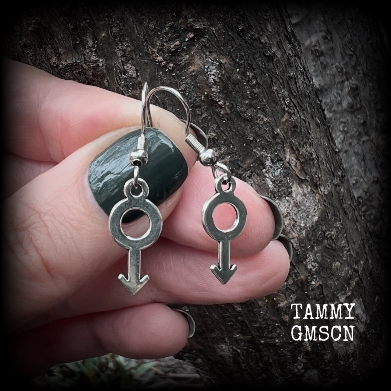 This pair of earrings features antique silver Male/Mars symbols, are nice and lightweight (at a gram or two each), measuring approx 3.5cms from tip to tip.

This pair has been made on stainless steel french hooks, for pierced ears.