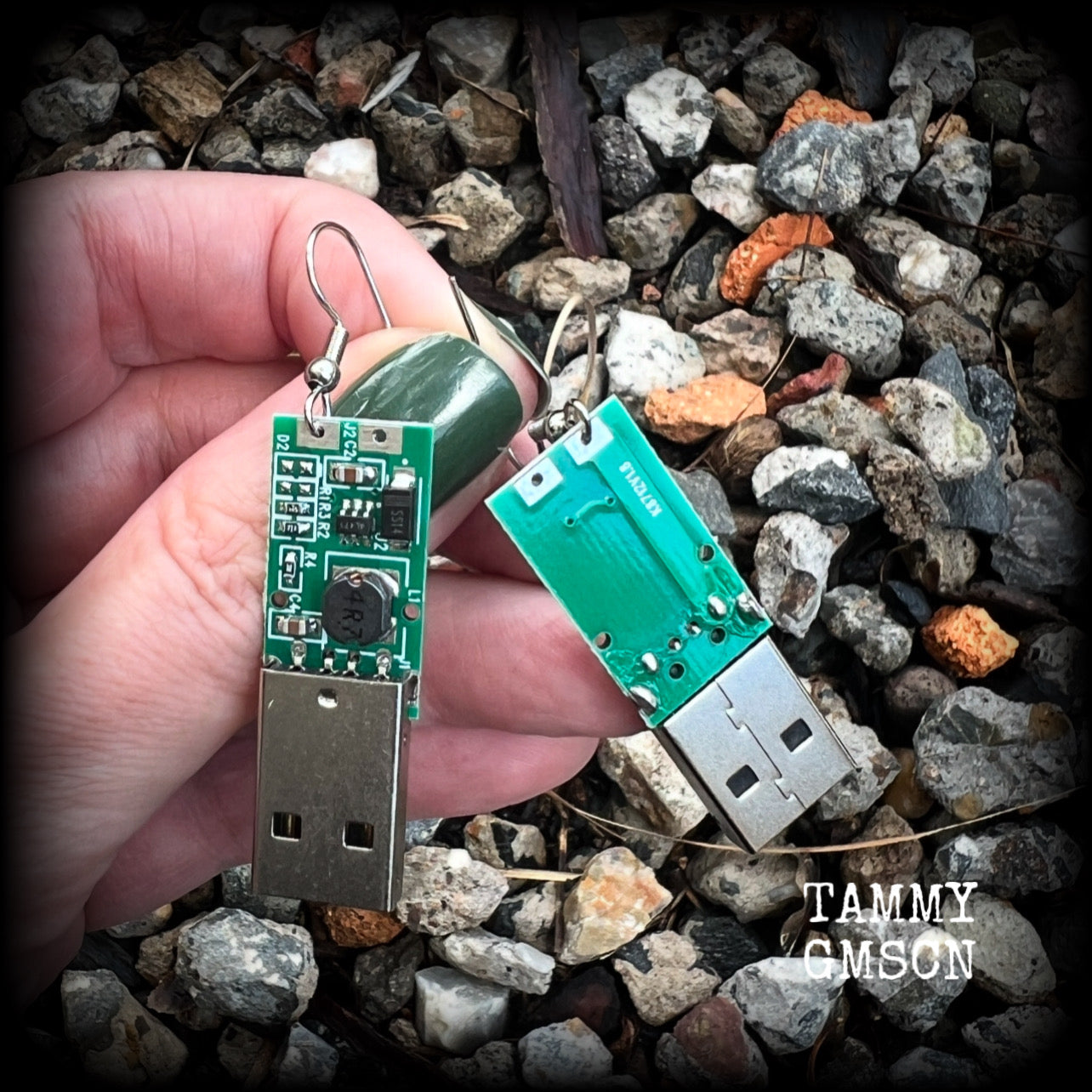 These awesome cyberpunk earrings feature a classic green USB, are nice and dangly, measuring just under 6cms from tip to tip, and nice and light weight, weighing only a few grams each.

This pair has been made on stainless steel french hooks, to be worn in pierced ears.