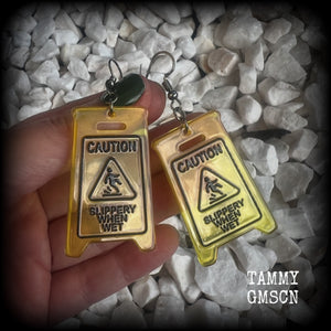 These awesome fluoro yellow acrylic ‘Slippery when wet’ sign earrings measure in at just on 7cms, are nice and light weighing only 4 grams each.

This pair has been made with stainless steel french hooks, for pierced ears.