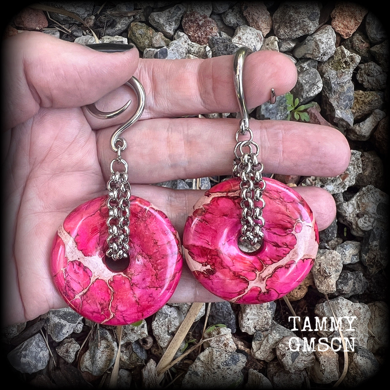 This pair of gorgeous ocean jasper earrings features beautiful pink marbled donut gemstones, weighing approx 19 grams a piece, and measuring 8cms from tip to tip.

This pair has been made on 6 gauge (4mm) surgical steel full curl hooks, to be worn in stretched lobes.
