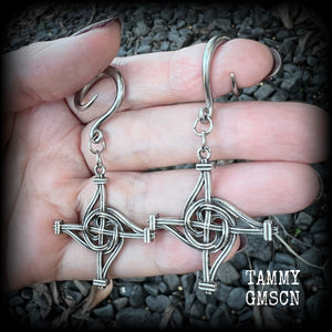 These gorgeous gauged earrings feature antique silver interwoven Brigids crosses, measuring approx 7.5cms from tip to tip, and weighing approx 7 grams each.

This pair has been made on 6 gauge (4mm) surgical steel full curl hooks, suitable for stretched lobes.