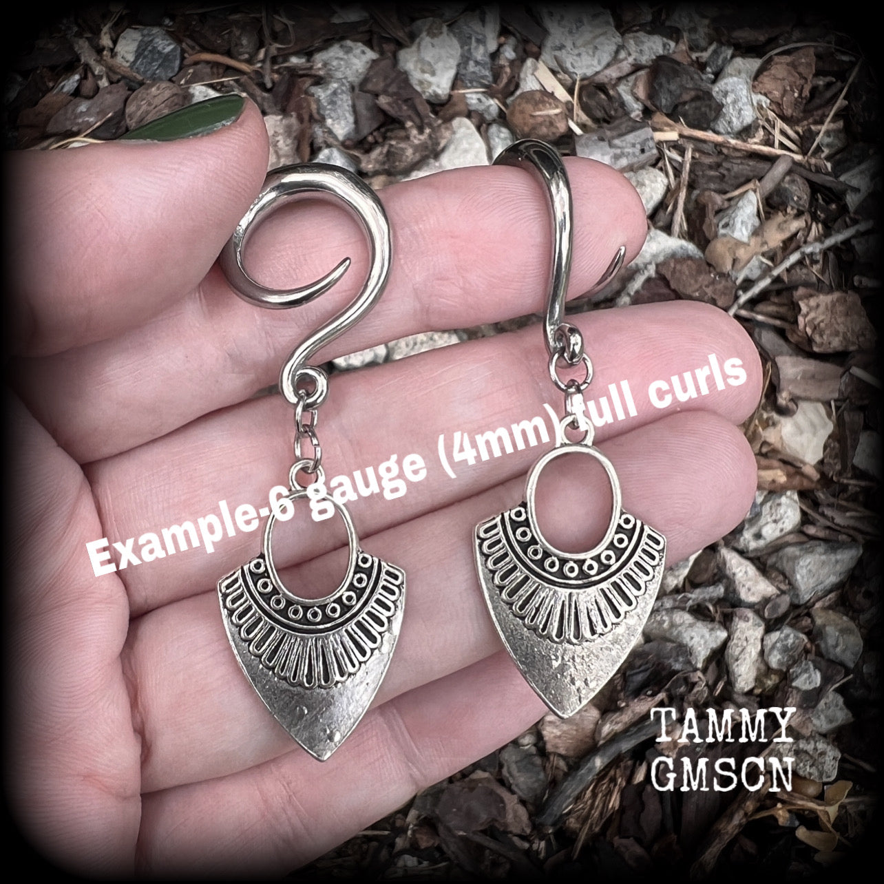 Inspired by Ishtar, Mesopotamian Goddess of love, beauty, sex and war, these beautiful tribal antique silver gauged earrings are nice and light weight, weighing approx 5 grams a piece, and are nice and dangly, measuring just on 6cms from tip to tip.
This pair has been made on 6 gauge (4mm) surgical steel full curl hooks, to be worn in stretched lobes.