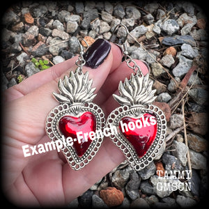 These beautiful red enamel and antique silver sacred heartearrings are nice and lightweight at approx 5 grams a piece, measuring just over 7cms from tip to tip.


This pair has been made on stainless steel french hooks to be worn through pierced ears.