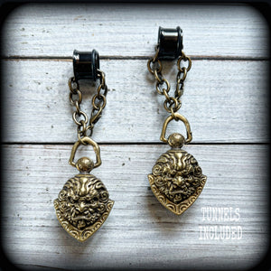 These unique tunnel dangles feature brass lion guardian bells, used in Tibetan Buddhism,  weighing approx 20 grams each, and measuring 8.5cms from tip to tip.  ✨ The ball inside the bell that rings has been disabled so these earrings wont make noise as you go about your day.