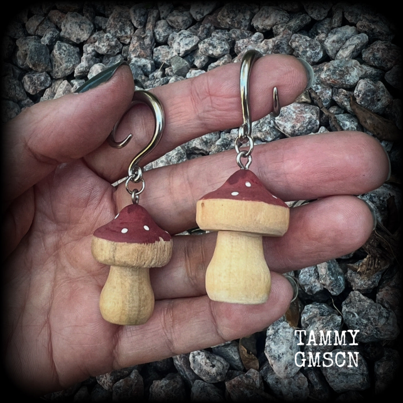 This pair of earrings features gorgeous dusty pink wood mushrooms, nice and light weight at 7 grams a piece, and nice and dangly at just on 6.5cms from tip to tip.

This pair has been made on 6 gauge (4mm) surgical steel full curl hooks, suitable for stretched lobes.