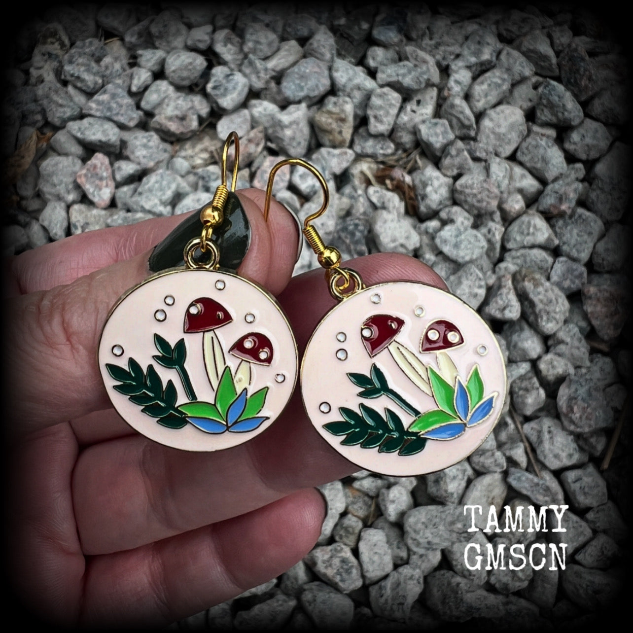 These adorable antique gold and enamel toadstool earrings measure in at just under 5cm, are nice and light, weighing only a few grams each.

This pair has been made with antique gold french hooks, suitable for pierced ears.