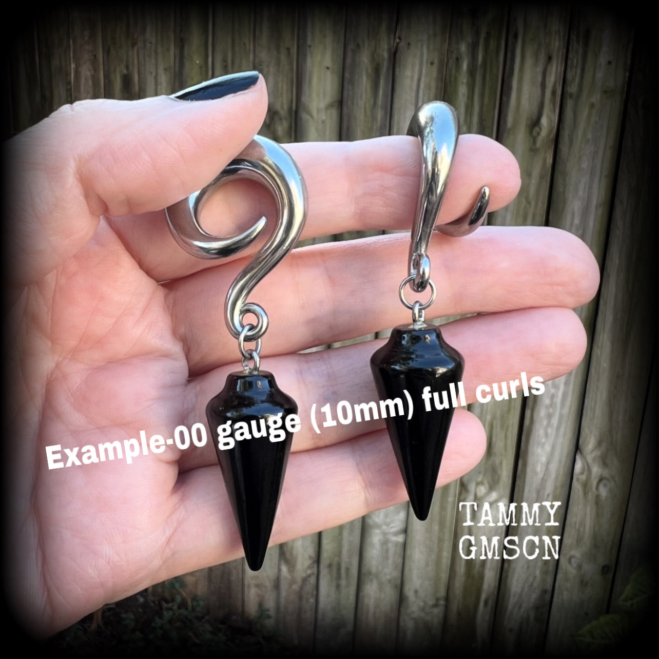 These earrings have been made with gorgeous pitch black obsidian pendulums, measuring 7.5cms from tip to tip, and weighing approx 22 grams each.

This pair have been made with 00 gauge (10mm) surgical steel full curl hooks, to be worn in stretched lobes.