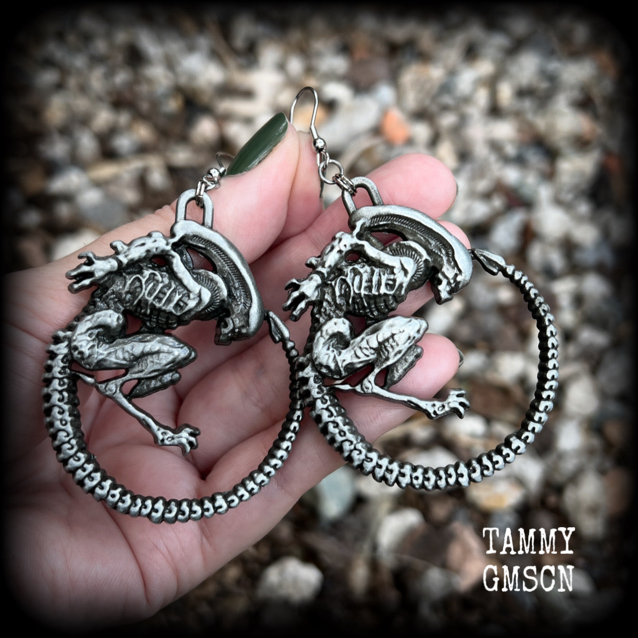 This pair of awesome earrings features large Alien Queen Xenomorphs, measuring 8.5cms from tip to tip (nice and big), and weigh 35 grams each (these are HEAVY).

This pair have been made with stainless steel french hooks-suitable for pierced ears.