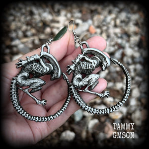 This pair of awesome earrings features large Alien Queen Xenomorphs, measuring 8.5cms from tip to tip (nice and big), and weigh 35 grams each (these are HEAVY).

This pair have been made with stainless steel french hooks-suitable for pierced ears.