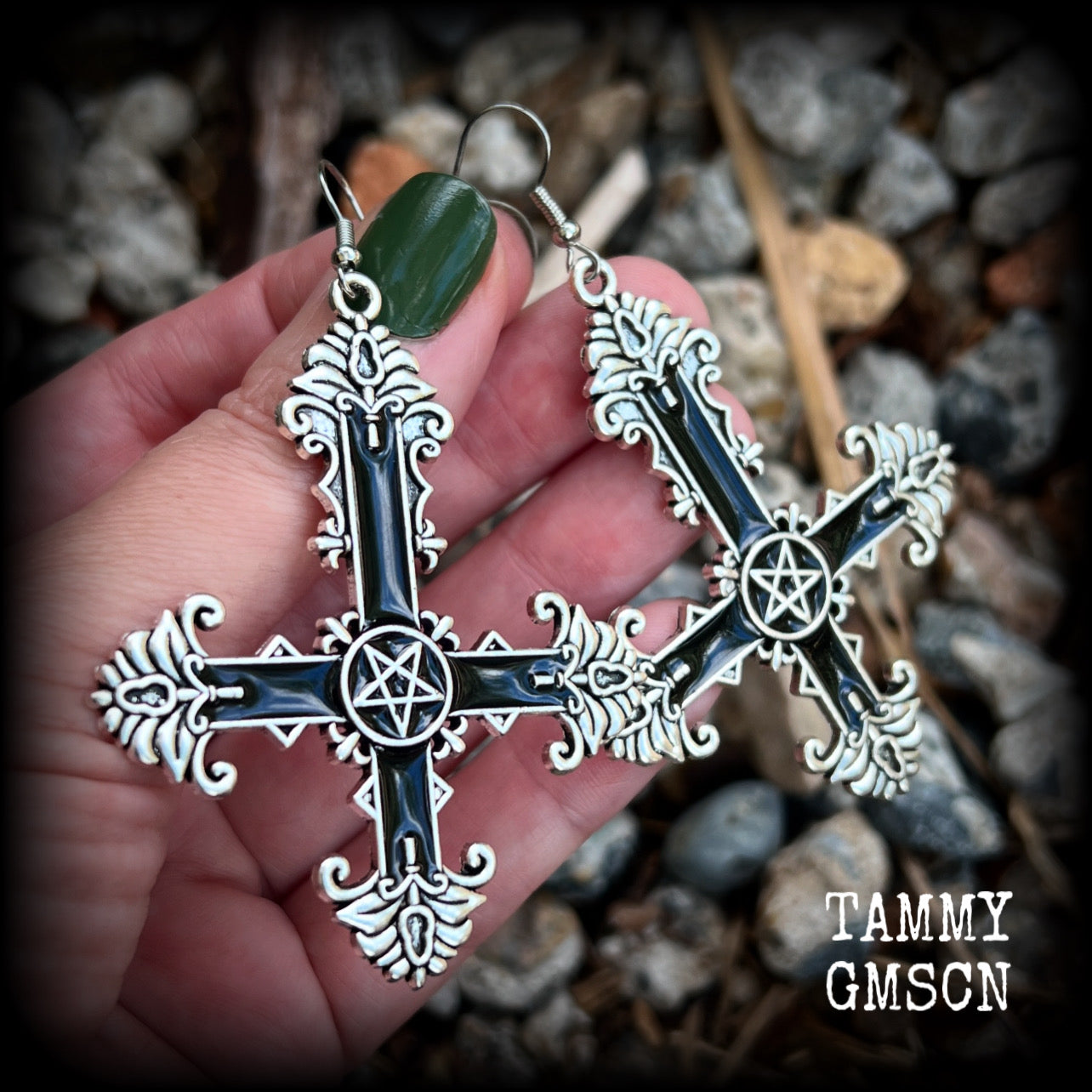 These gorgeous gothic earrings feature a black enamel inverted cross with a silver inverted pentagram, measuring just on 8.5 cms from tip to tip, and weigh approx 10 grams a piece.

This pair have been made on stainless steel french hooks, suitable for pierced ears.