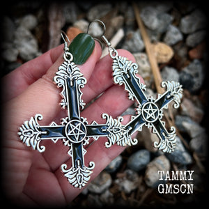 These gorgeous gothic earrings feature a black enamel inverted cross with a silver inverted pentagram, measuring just on 8.5 cms from tip to tip, and weigh approx 10 grams a piece.

This pair have been made on stainless steel french hooks, suitable for pierced ears.