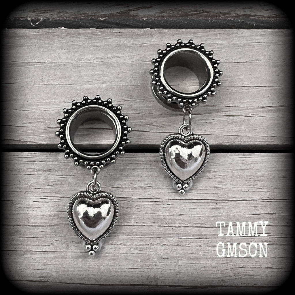 These gorgeous tunnel earrings feature beautiful antique silver hearts, are nice and lightweight, weighing only 7 grams each and measure approx 4.5cms from tip to tip.
This pair has been made with 9/16" (14mm) gauge ornate surgical steel screw fit tunnels.
