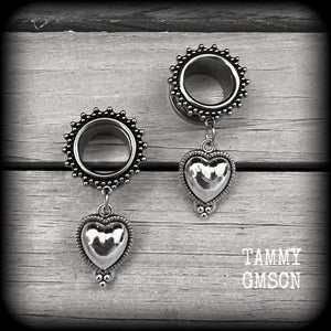 These gorgeous tunnel earrings feature beautiful antique silver hearts, are nice and lightweight, weighing only 7 grams each and measure approx 4.5cms from tip to tip.
This pair has been made with 9/16" (14mm) gauge ornate surgical steel screw fit tunnels.