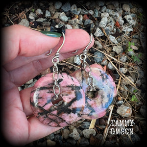 This is a pair of gorgeous ear hangers featuring dusty pink and chocolate brown Rhodonite gemstone donuts cradled in antique silver chain, weighing approx 23grams a piece, and measuring just under 7 cms from tip to tip.

This pair has made with small antique silver shephards hooks, to be worn with silicone earlets in stretched lobes from 8gauge (3mm).