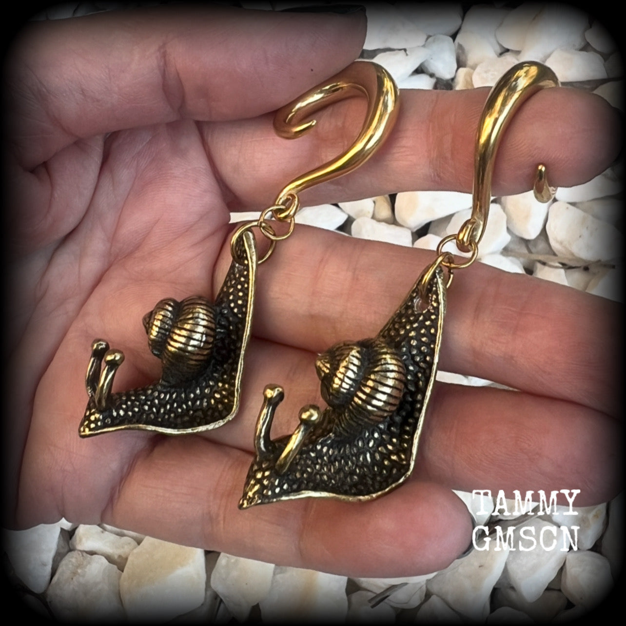 These awesome brass snail ear hangers feature gorgeous brass garden snails, measuring just on 7.5cms from tip to tip, and weighing approx 30 grams each.

This pair has been made on 2 gauge (6mm) surgical steel full curls, suitable for stretched lobes.