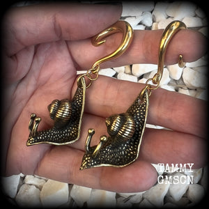 These awesome brass snail ear hangers feature gorgeous brass garden snails, measuring just on 7.5cms from tip to tip, and weighing approx 30 grams each.

This pair has been made on 2 gauge (6mm) surgical steel full curls, suitable for stretched lobes.