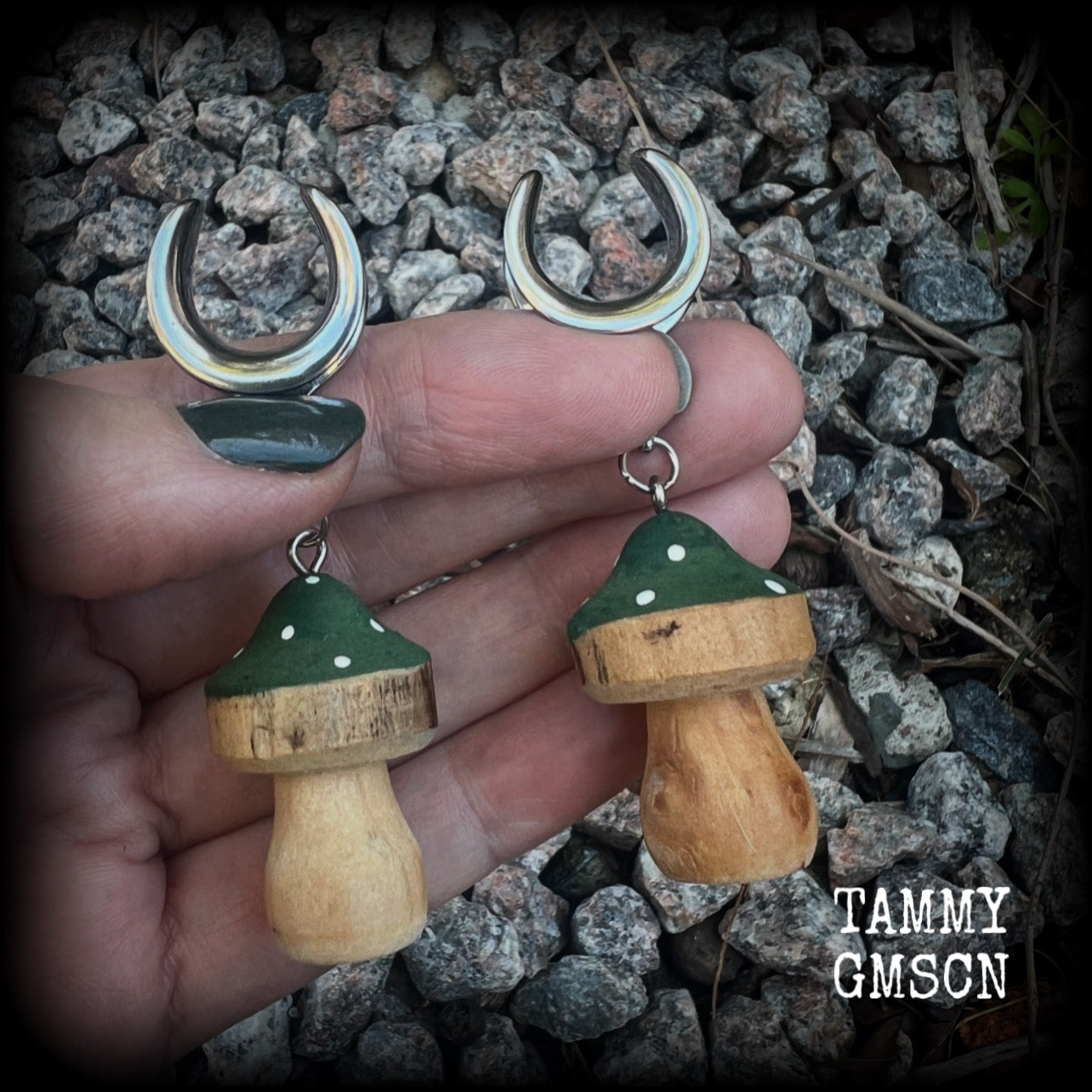This pair of earrings features gorgeous forest green wood mushrooms, nice and light weight at 8 grams a piece, and nice and dangly at just on 7cms.

This pair has been made on 5/8” gauge (16mm) surgical steel cradles, suitable for stretched lobes.

