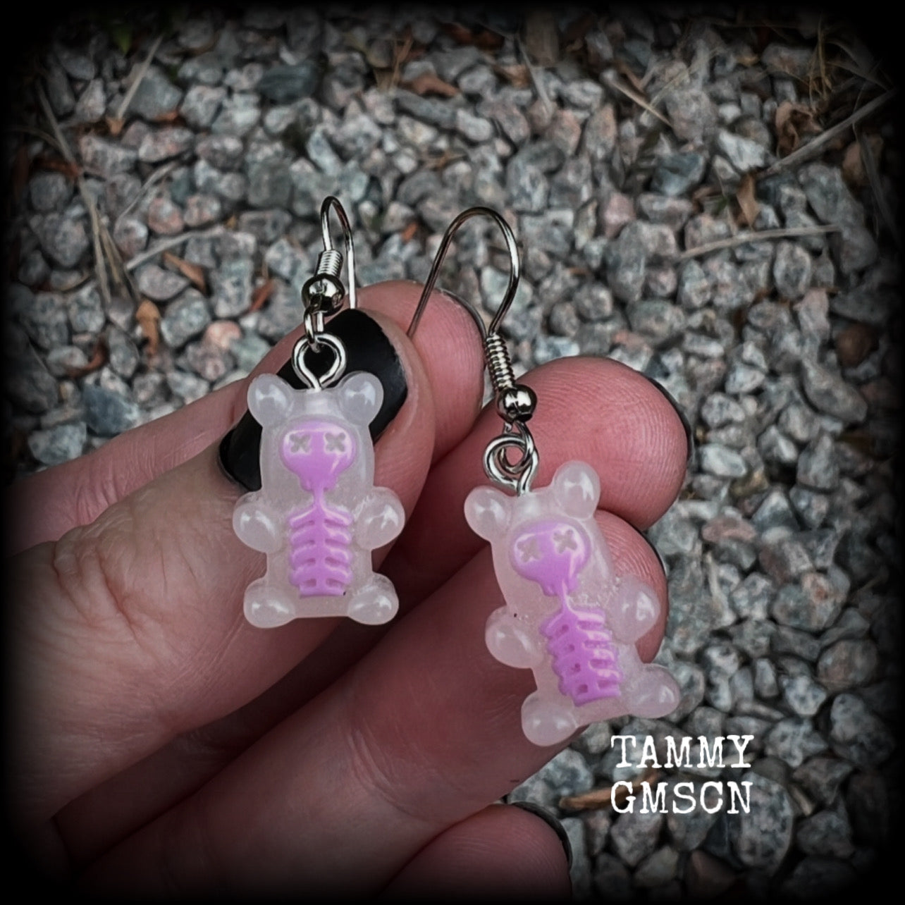 Featuring spooky cute pink skeleton gummy bears, these adorable earrings measure just on 5cms from tip to tip and are super light weight, weighing only a gram or two each.

This pair has been made with stainless steel french hooks, to be worn in pierced ears.