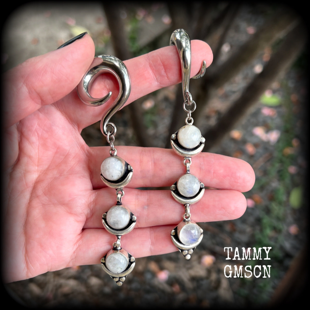 These beautiful boho Rainbow moonstone earrings are made with gorgeous polished gemstones, lovely and dangly measuring approx 10cms from tip to tip, and weighing approx 21 grams each. 

These earrings have been made on 00 gauge (10mm) surgical steel full curl hooks, to be worn in stretched lobes.